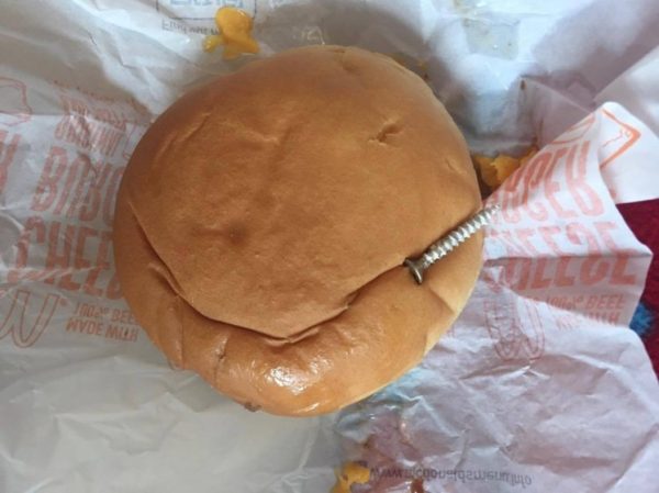 The McDonalds with the rogue screw which was served to the Wood family in Falmouth. See SWNS story SWSCREW; This is definitely something you do not expect to find when you unwrap a takeaway burger. But a Cornish dad was shocked to discover a screw in his son's Happy Meal from McDonald's. Natalie Wood has told Pirate FM it happened after her husband took their boys to the restaurant in Falmouth. The manager immediately offered to replace the meal after she called to complain on bank holiday Monday. Natalie said: "My husband took both sons to Mcdonalds in Falmouth and purchased happy meals for them both.